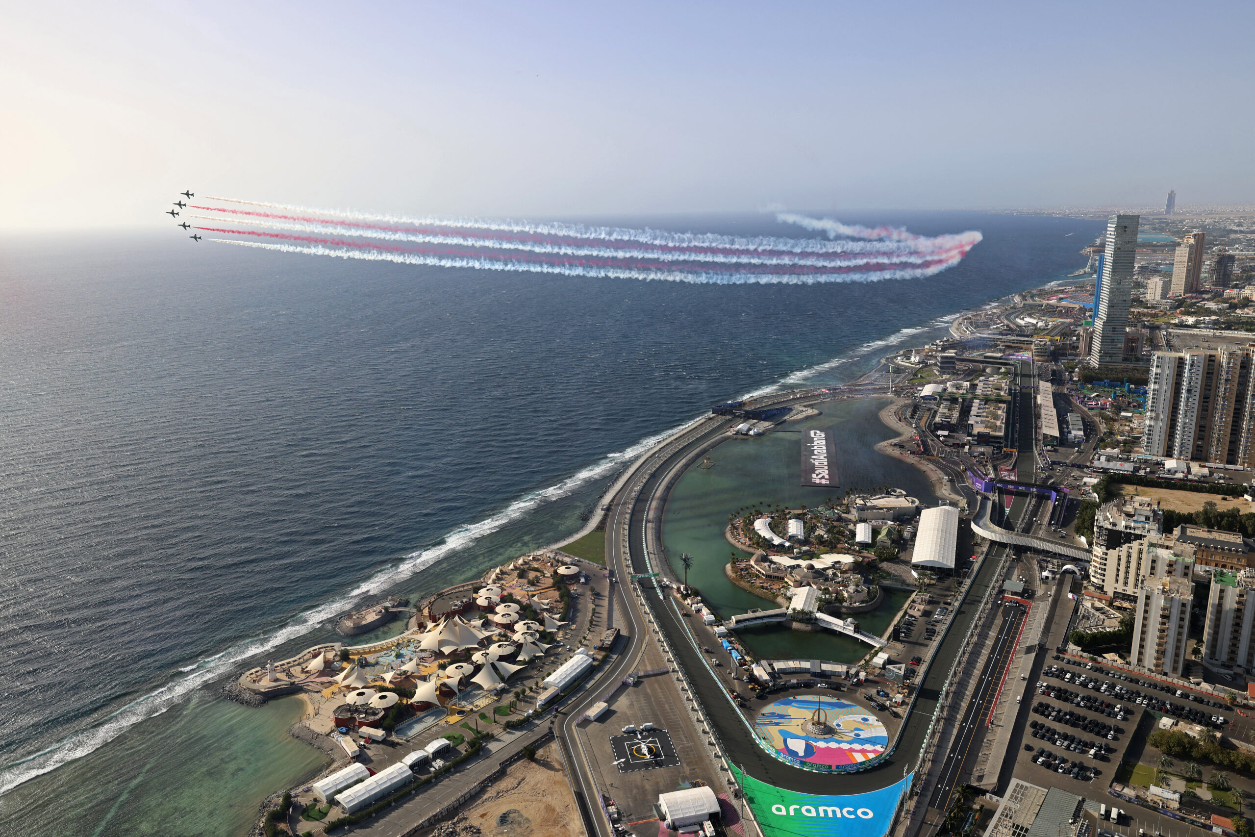 Description and source: The Saudi Hawks aerobatics team performs during an airshow before the start of the third practice session of the Saudi Arabian Formula One Grand Prix at the Jeddah Corniche Circuit in Jeddah on March 8, 2024. (Photo by JOSEPH EID / AFP)